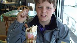 Ash enjoys his Knickerbocker Glory at the Tasty Corner Cafe, West Looe